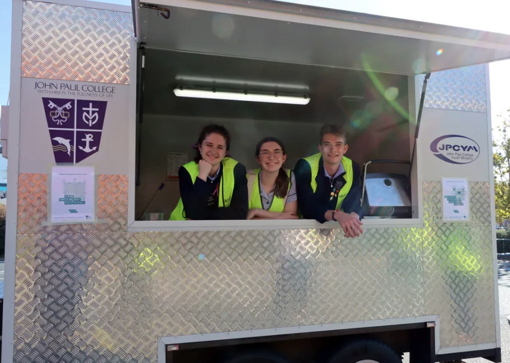 Student volunteers at the food and outreach van